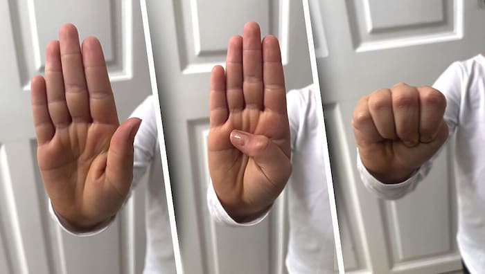 The child drew the police officers' attention to the abduction with the SOS distress sign.