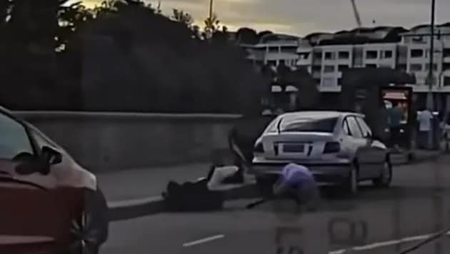 Video footage shows the brave passer-by wrestling with the attacker and both falling to the ...