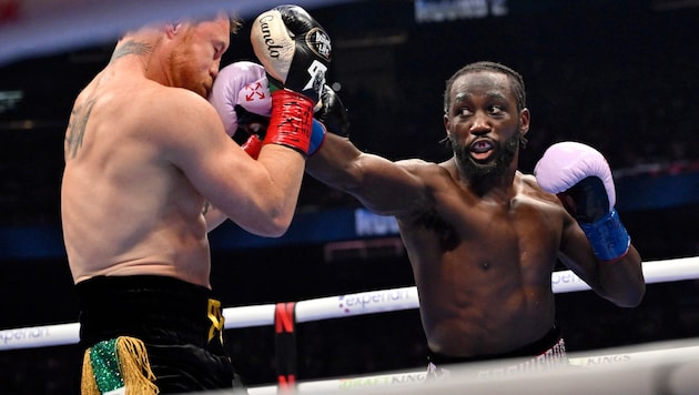 Terence Crawford (re.) macht Schluss.