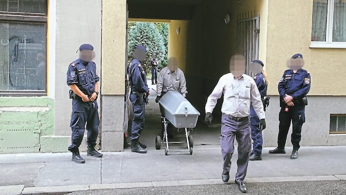 September 18, 2017: Undertaker, at the crime scene, removing the victim's body.