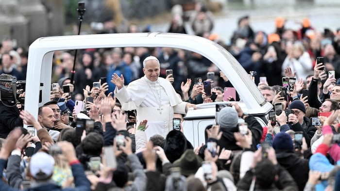 Tens of thousands of believers flocked to St. Peter's Square despite the rain.