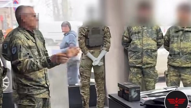 The non-commissioned officer (left) is said to have heavily promoted the goods on offer at the ...