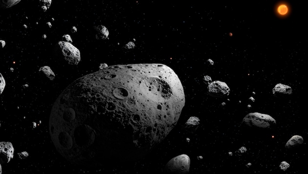 Diese künstlerische Darstellung zeigt den Asteroiden 2025 MN45 (Bildmitte), umgeben von vielen ...