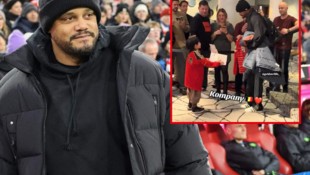 Vincent Kompany mit einem kleinen Fan im Tauschgeschäft.