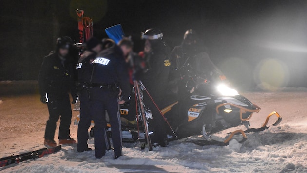 Emergency services recovering the body.