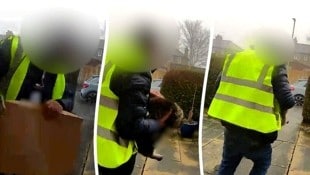 Er stellt das Paket ab und greift sich die Katze – nicht ahnend, dass er dabei gefilmt wird.