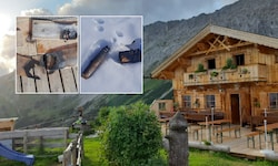 Verkohlte Bretter, ein Loch im Terrassenboden und angebranntes Holz vor der Hütte: Die ...
