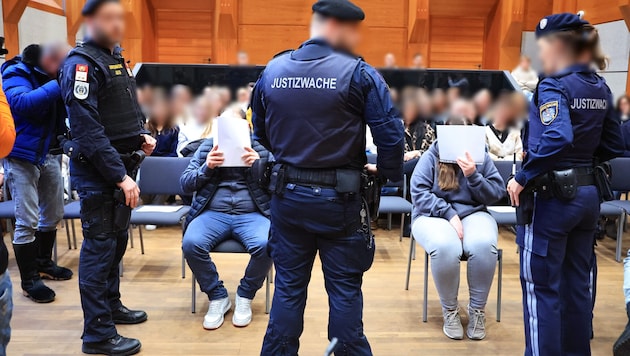 The parents covered their faces during Monday's court proceedings.