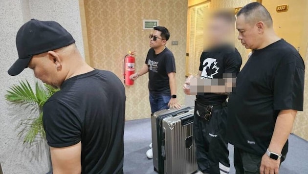 Officers with the arrested Austrian (23) shortly after his arrest.