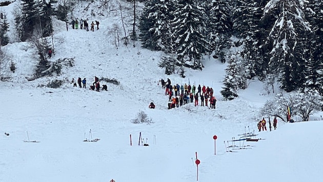 Mountain rescuers and other winter sports enthusiasts searched for the buried victims in St. ...