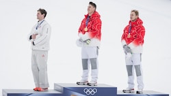 Ryan Cochran-Siegle, Franjo von Allmen und Marco Odermatt (v.l.n.r.) erhielten ihre ...