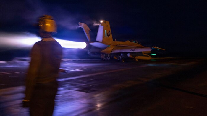 A US Super Hornet fighter jet takes off from the aircraft carrier Abraham Lincoln on Sunday, ...
