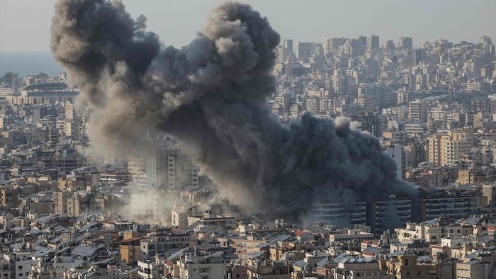 Smoke rises from the site of an Israeli airstrike that targeted an area in the southern suburbs ...