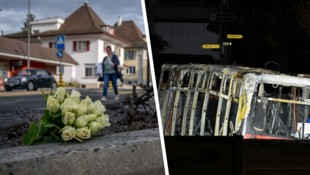 Dort, wo der Bus brannte, wurden Blumen niedergelegt. Von dem Bus blieb nur eine verkohlte Hülle ...