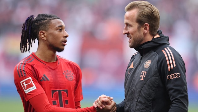 Michael Olise (l.) mit Sturm-Kollege Harry Kane (r.)