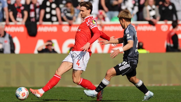 Für Stefan Posch (li.) und seine Mainzer hat es gegen Eintracht Frankfurt einen späten 2:1-Sieg ...