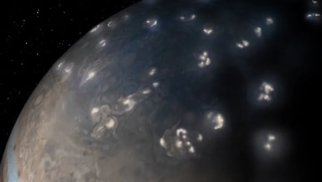 Auf dem massereichen Jupiter toben gewaltige Stürme, die gewaltige Blitze (die hellen Flecken im ...