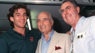Jack Brabham mit Ayrton Senna und Juan Manuel Fangio (M.).