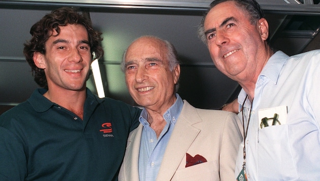 Jack Brabham mit Ayrton Senna und Juan Manuel Fangio (M.).