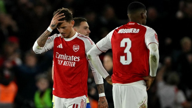 Long faces among the Arsenal players...