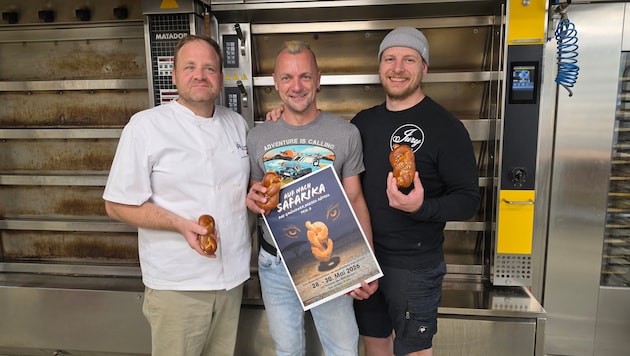 V.l.n.r. Pietschnigg mit Eggeler und Jury. Teil des Erlöses der Brezel geht an die Schule.