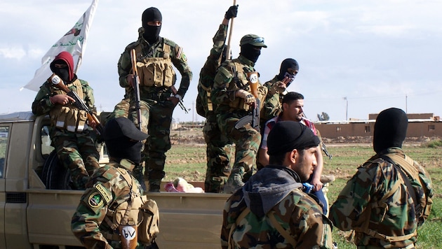 Archivbild aus dem Jahr 2015: Mitglieder der Schiiten-Miliz Asaib Ahl Al-Haq