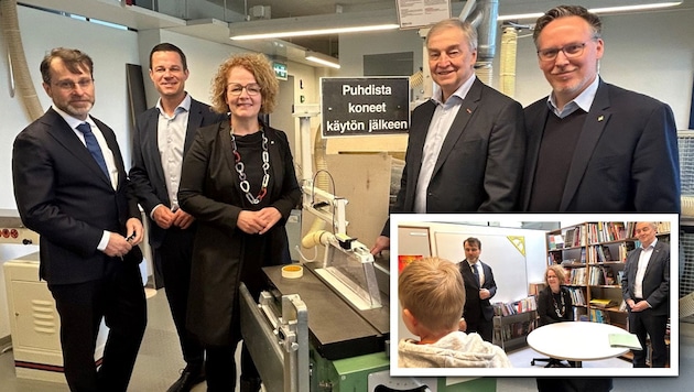 Gemeinsam mit dem Schuldirektor der Grundschule Roihuvuori (li.) machen sich Christiane ...