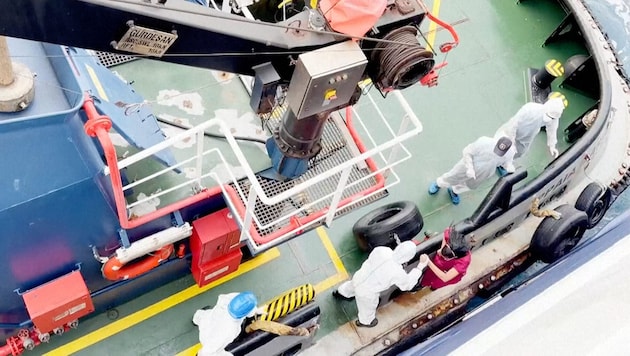 Medical professionals on board the Hondius following the virus outbreak