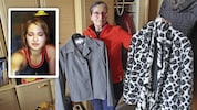 Annemarie Kammerer mit Kleidern ihres getöteten Kindes