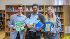 Konstantin Hofer (17), Lehrer Markus Lienhart und Valentina Schubert (17) eint die Freude an ...