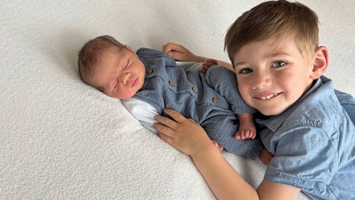Proud big brother Jakob with baby Simon