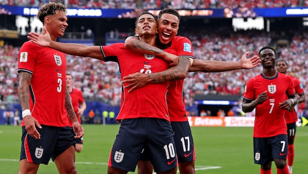 The “Three Lions” celebrate winning the group.