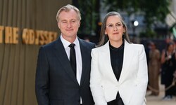 Der Regisseur mit seiner Frau, Produzentin Emma Thomas, die seine Anrufe anzukündigen scheint.