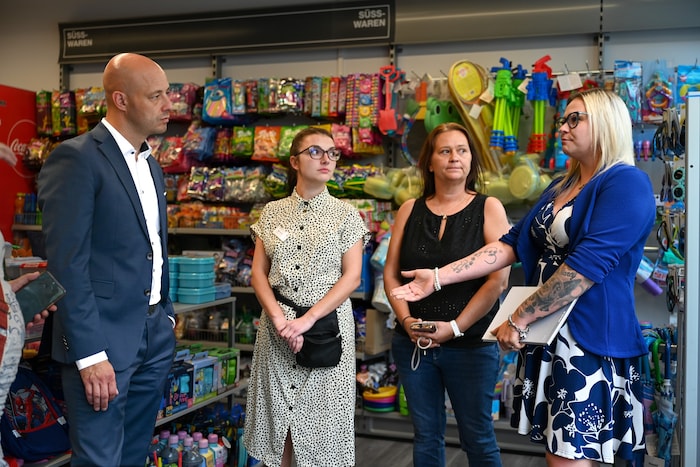Store Manager Shkliaruk (left), Sales Manager Geringer (right) during an on-site inspection with ...