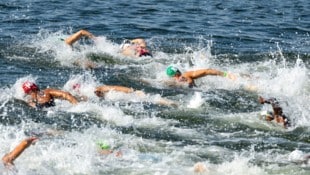 GEPA Luca Karl (grüne Badehaube) und seine Kollegen wollen nicht in der Seine schwimmen.