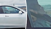 Fahrer und Beifahrer vertrauen komplett auf die Technik und schlafen, während ihr Auto von ...