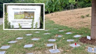 Nur noch vereinzelte Kerzen stehen auf den Urnengräbern in St. Florian (Oberösterreich).