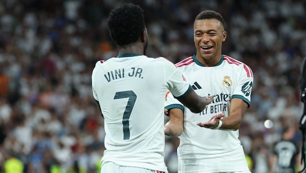 Kylian Mbappé (right) scored three times.