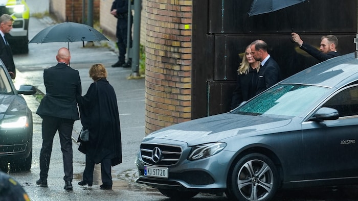 Queen Sonja, King Haakon, and Queen Mette-Marit walk to their cars as King Harald’s coffin ...