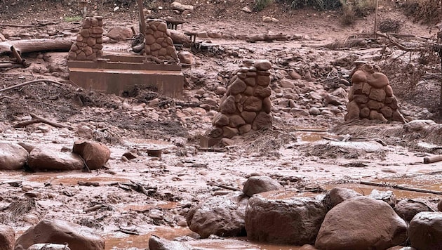 After the flooding, only the pillars remain of this stone bridge in the Grand Canyon.