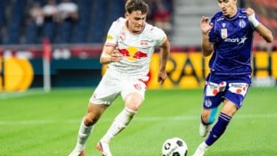 Nach der Austria gastiert heute Rapid bei Salzburg um Bartosz Mazurek (li.).