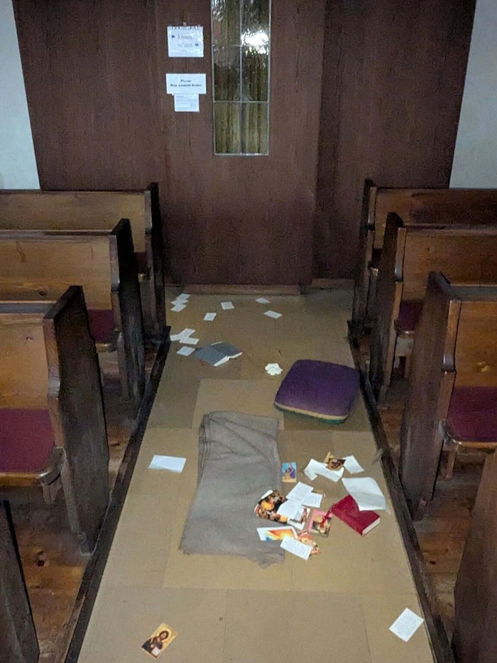 Devastation in front of the confessional.