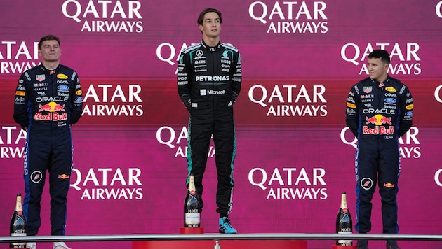 George Russell (center) won ahead of Max Verstappen (left) and Isack Hadjar.