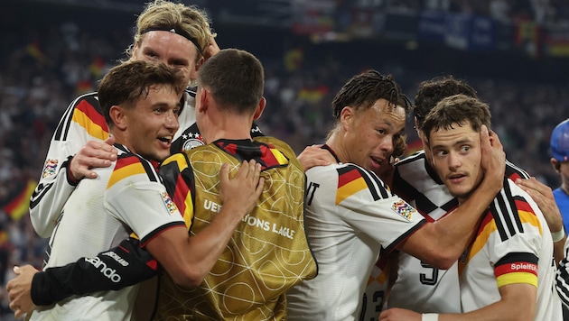 Germany celebrates a 2–0 win over Serbia.