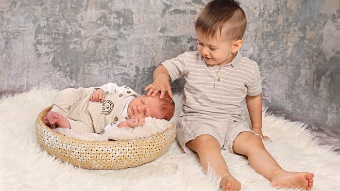 Proud big brother Jonas with baby Lukas