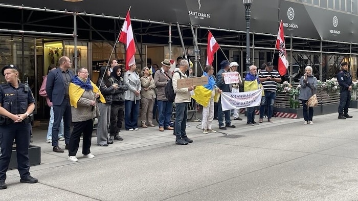 Pro-Ukraine demonstrators gathered Friday morning in front of the Ministry of the Interior in ...