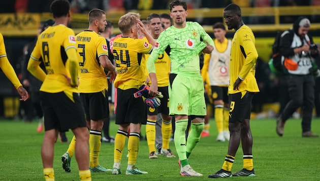 Stunned reactions from the Dortmund players