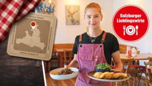 Kellnerin Lisa Pohn serviert zwei Schmankerl des Hauses – Wiener Schnitzel und Ossobuco auf ...