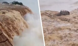 Videos zeigen, wie braune Wassermassen über die Felsen donnern.