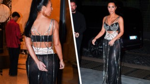 Kim Kardashian war in Rom plötzlich ganz gschamig und versuchte, ihren heißen Look mit ihrem Arm ...